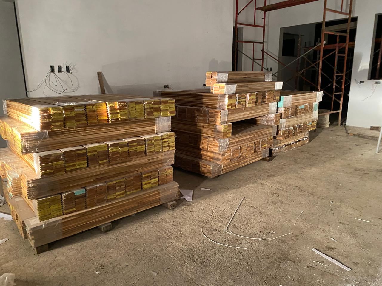 Palletized lumber staged for door-to-door delivery
