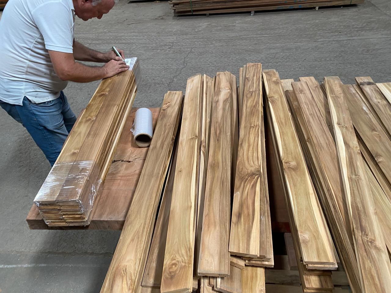 Teak boards inspected and labelled before packing